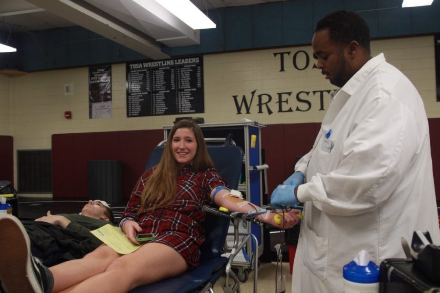Wauwatosa West student donates blood at last years blood drive in the Upper Gym.