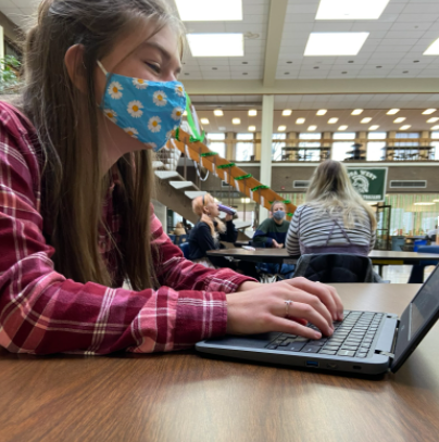 Wauwatosa West Sophomore Lexi Pitcher completes an assignment during her lunch period.