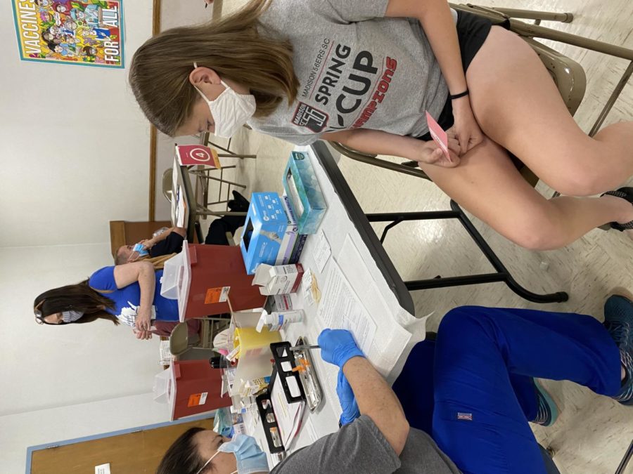 Sophomore Hannah Veenendaal gets her vaccine after it was approved for children ages 16+. 