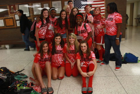 This picture was taken eleven years ago during the homecoming week of 2010. During that year, juniors were red and had to distribute as much red tape as they possibly could. 
