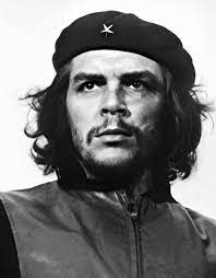 A portrait replicating this famous photo hangs in the language hallway, with the word Revolución.
