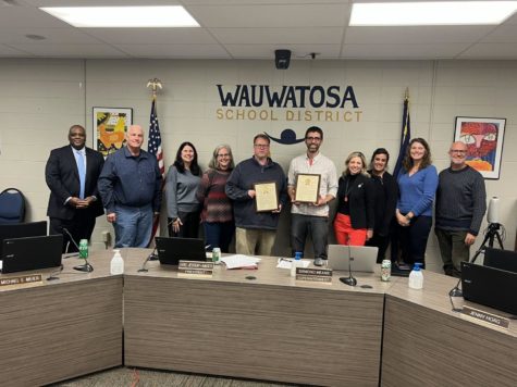Tosa East Tech Ed teacher Craig Griffie receiving a plaque from Representative Vining recognizing the district as an Apprenticeship Ambassador. 