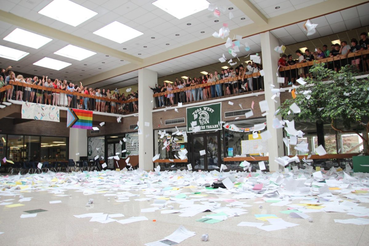 Over 250 seniors gathered on the balcony to participate in the annual paper toss.